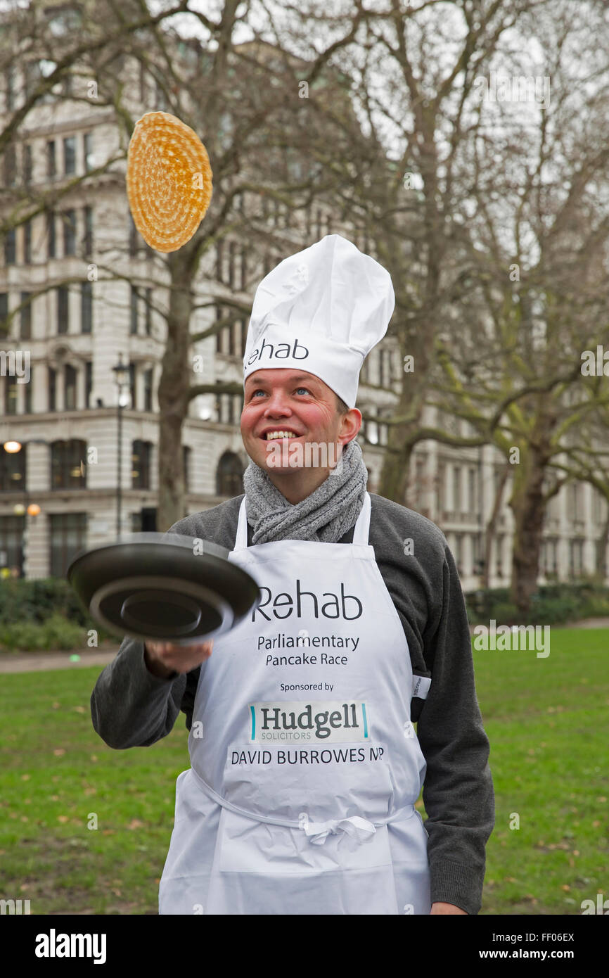 Westminster,UK,9th February 2016,David Burrowes MP tosses a pancake at the Rehab Parliamentary Pancake Race 201 Credit: Keith Larby/Alamy Live News Stock Photo