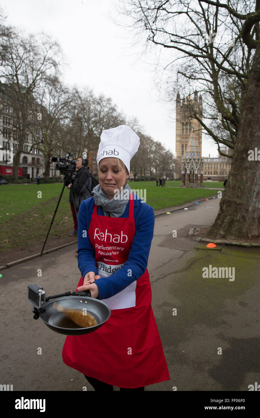 Westminster,UK,9th February 2016,Sophy ridge, Sky news, tosses a pancake with her go pro frying pan at the Rehab Parliamentary Pancake Race 201 Credit: Keith Larby/Alamy Live News Stock Photo