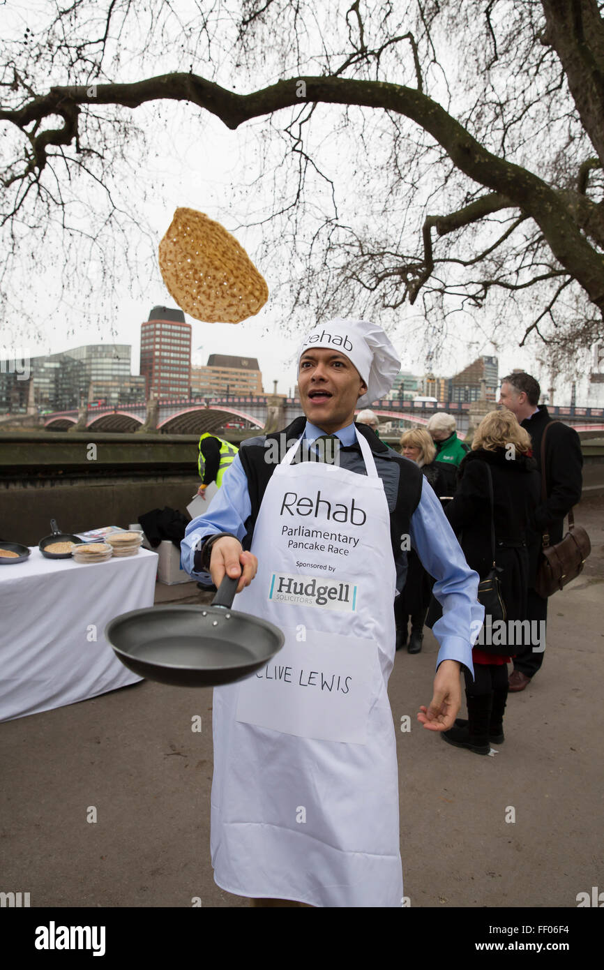 Westminster,UK,9th February 2016,Clive Lewis tosses a pancake at the Rehab Parliamentary Pancake Race 201 Credit: Keith Larby/Alamy Live News Stock Photo