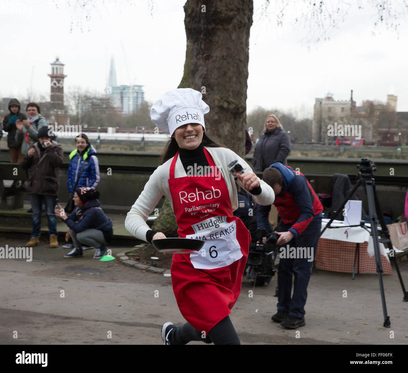 Westminster,UK,9th February 2016,Mia Reakes, runs at the Rehab Parliamentary Pancake Race 201 Credit: Keith Larby/Alamy Live News Stock Photo