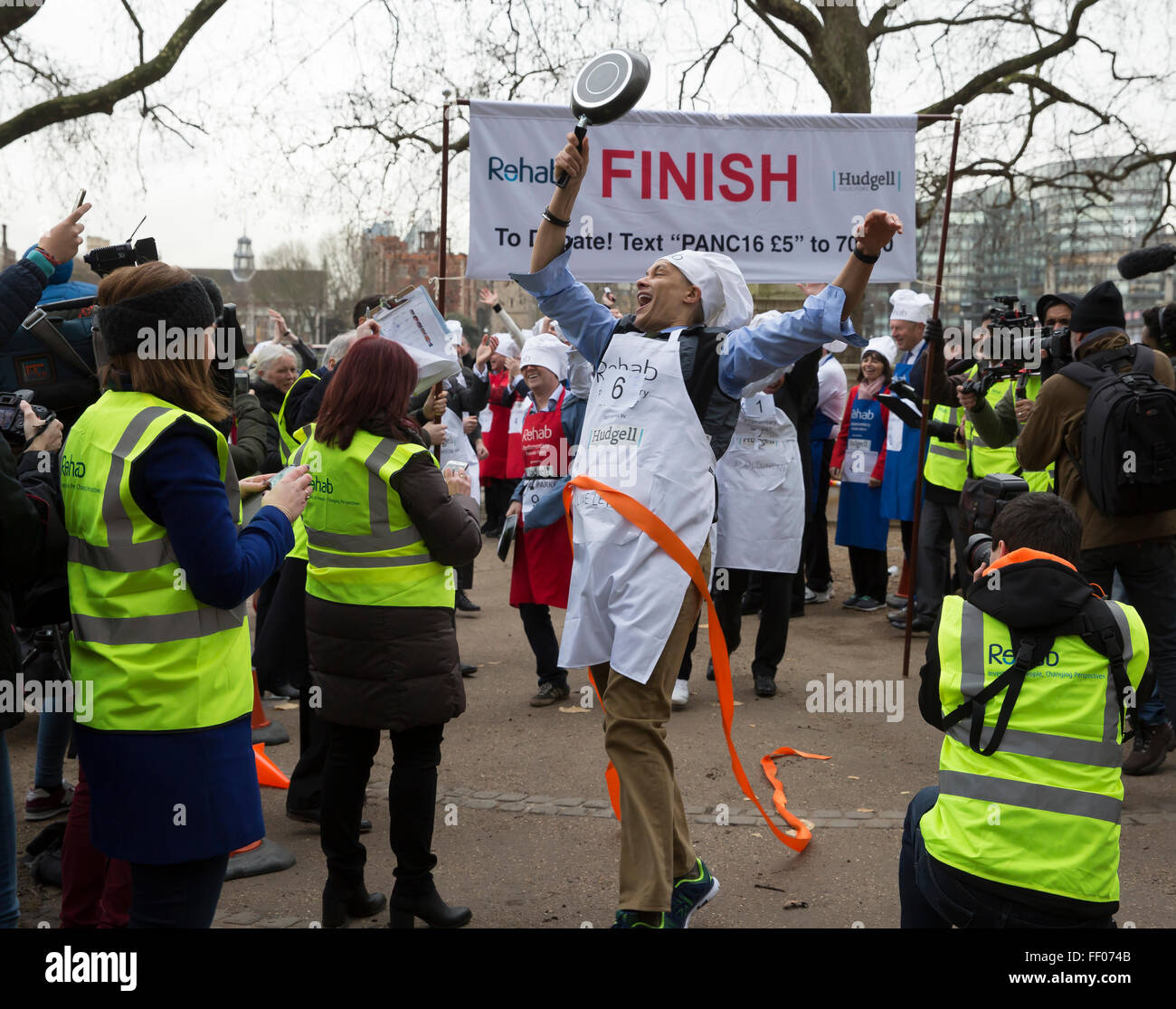 Westminster,UK, 9th February 2016, Clive Lewis wins the Rehab annual pancake race 201 Credit: Keith Larby/Alamy Live News Stock Photo