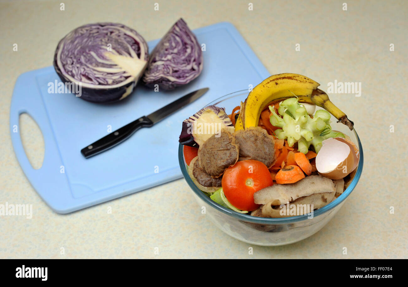 Vegetable food waste collected for composting, beside red cabbage being