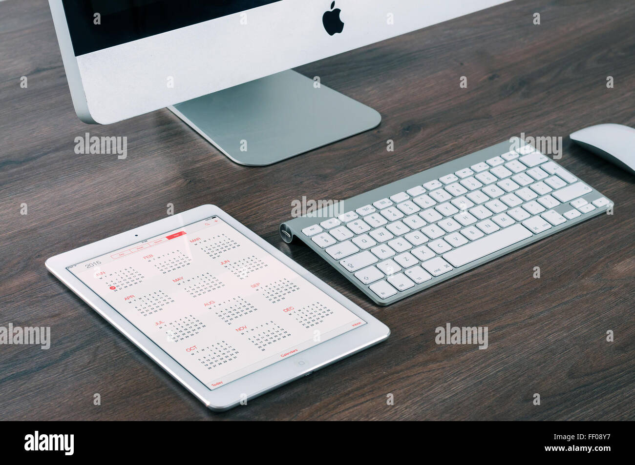 An image showcasing an Apple iPad and an iMac, both part of Apple's ...