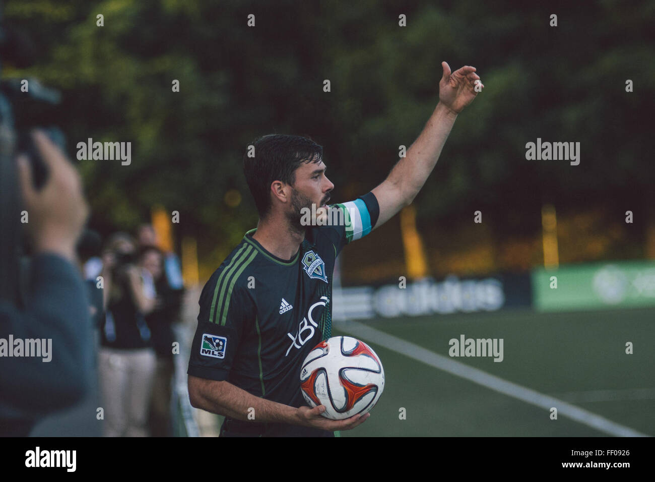 Male Soccer/Football Player Holding Ball Male SoccerFootball Player Holding Ball Stock Photo