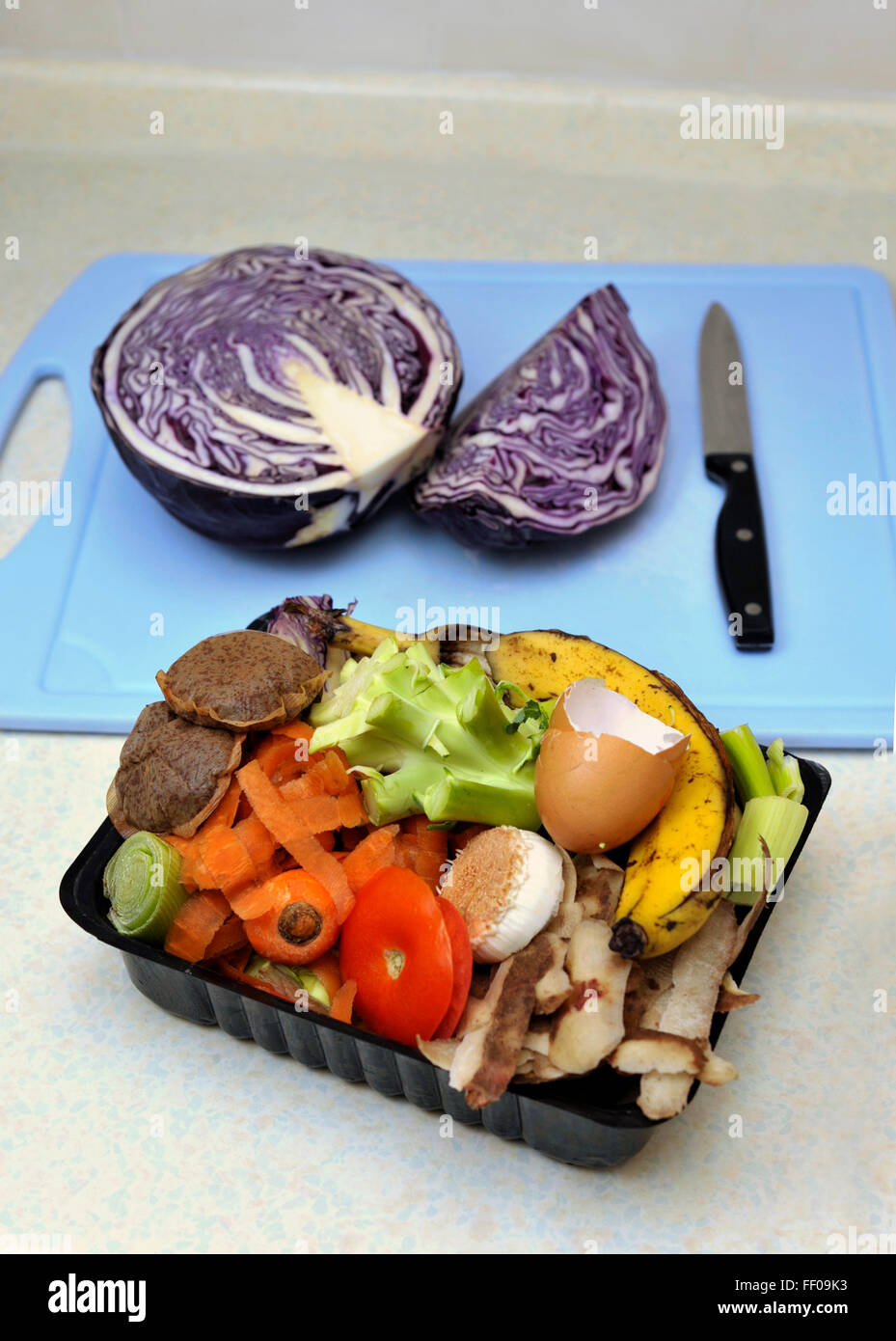 Vegetable food waste collected in a reused container for composting