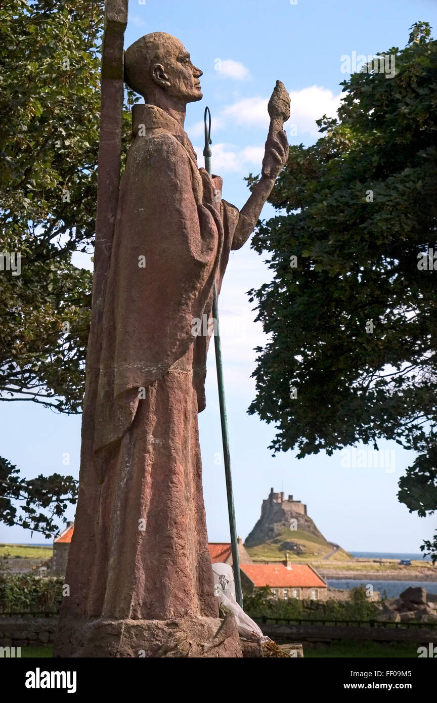 Saint Aidan's statue in the grounds of Holy Island Church, Lindisfarne, Northumberland Stock Photo