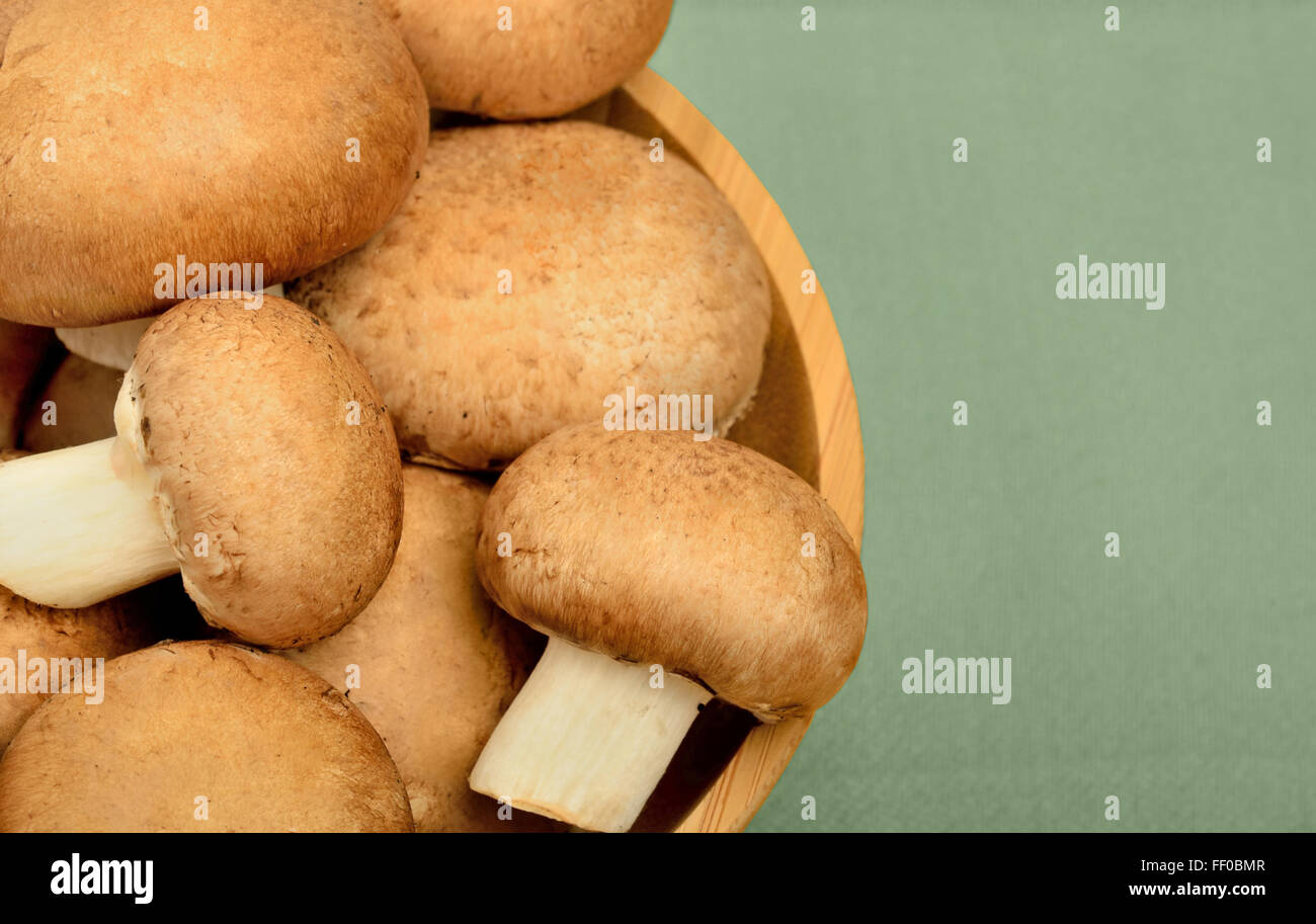 Bowl with champignon on table Stock Photo