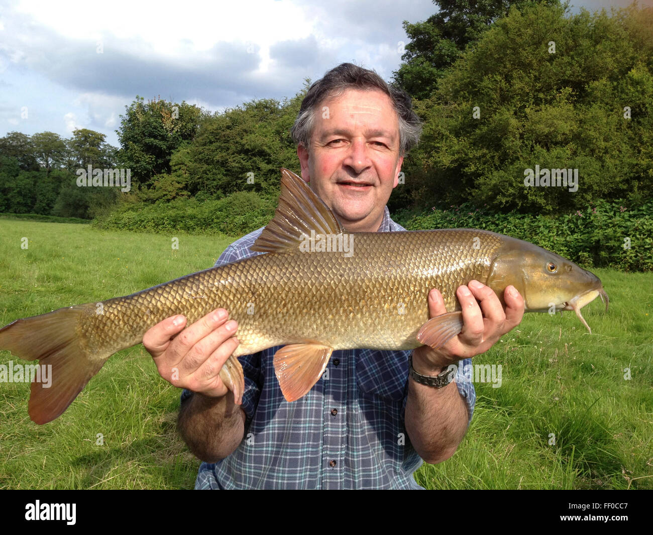 Angler with 10lb 10oz barbel caught from River Wye at The Warren Hayon