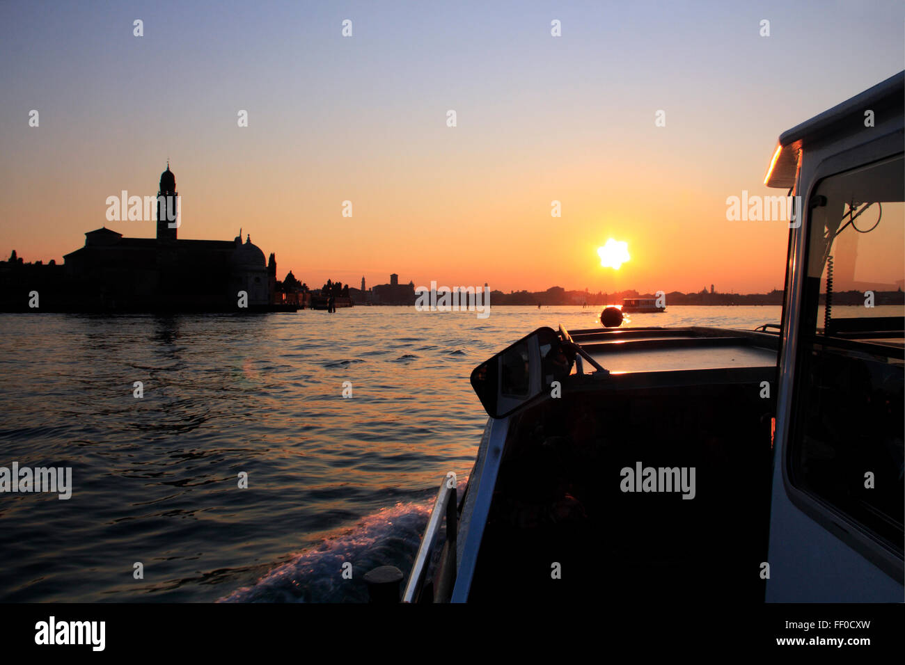Boats on The Grand Canal in Venice, Italy at sunset Stock Photo