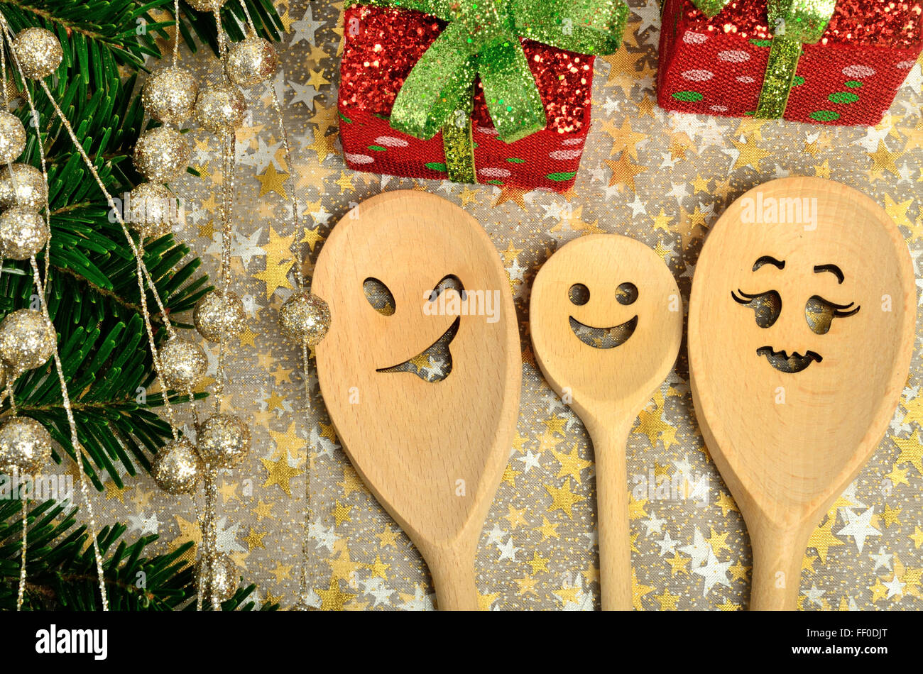 Family wooden spoon with tree branch and box christmas Stock Photo