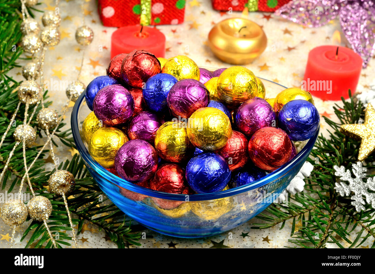 Bowl with colorful chocolate with christmas decoration Stock Photo