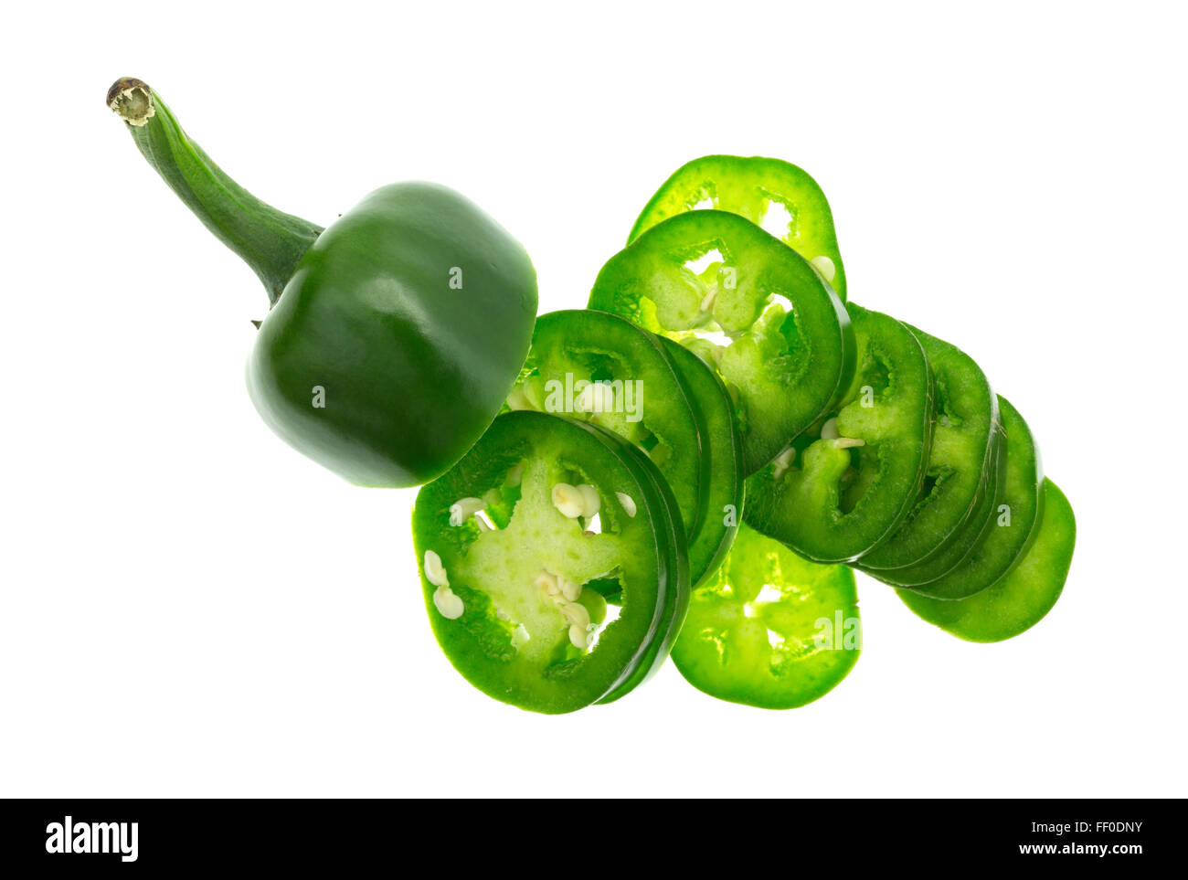Top view of a sliced jalapeño pepper with the stem section in the group