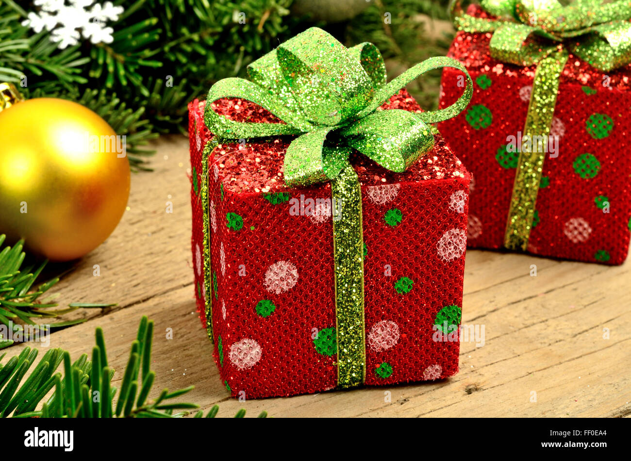 Box Christmas with tree branch decoration on wooden table Stock Photo