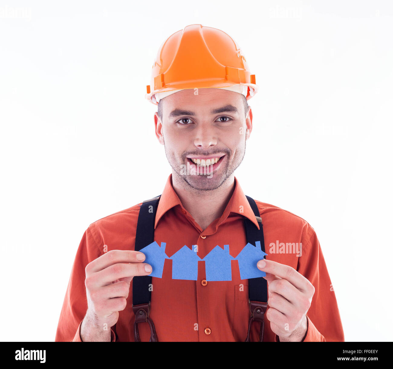 Contruction Paper Man A builder man holding paper houses Stock Photo - Alamy