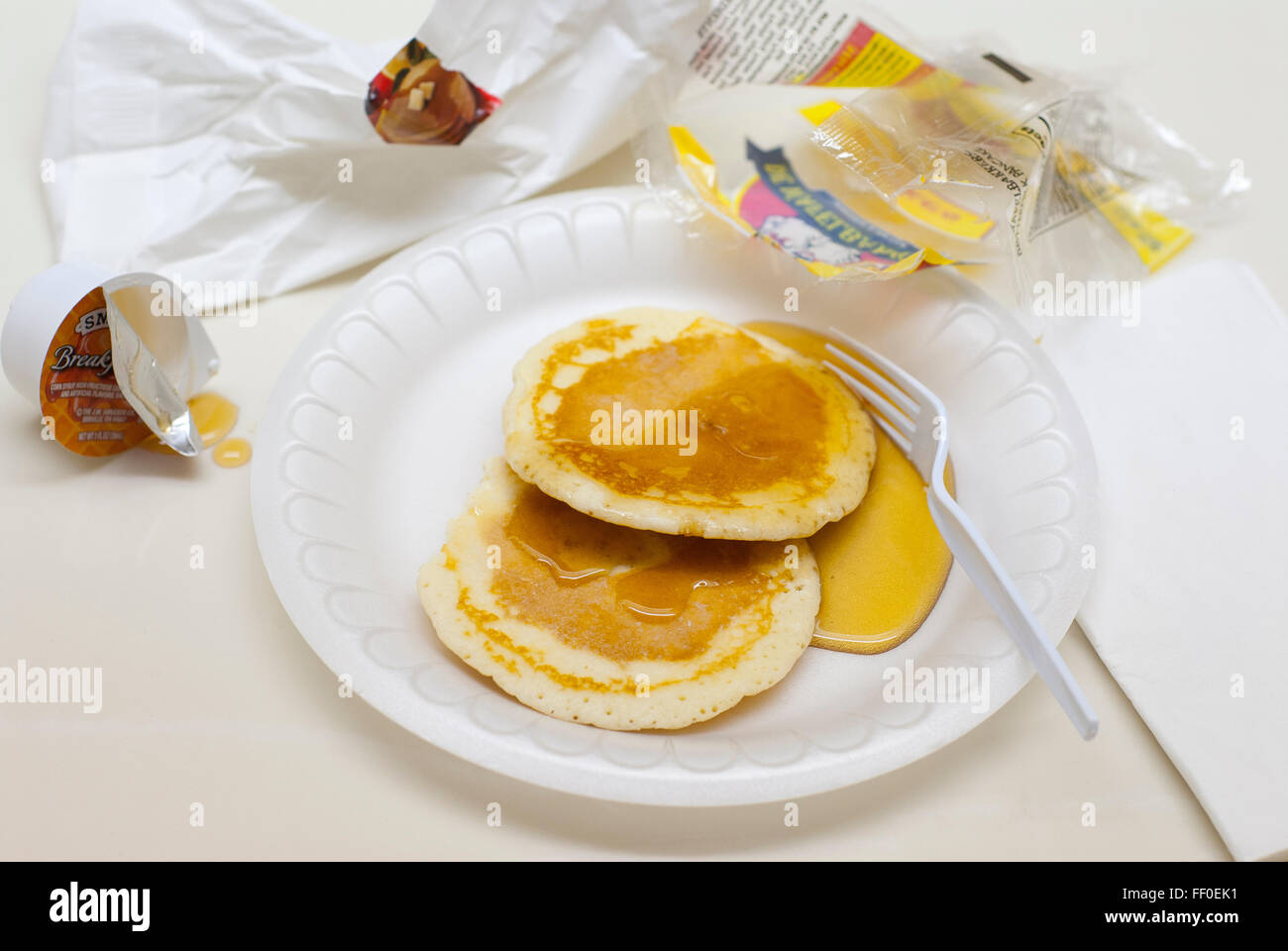 Prepackaged processed hotel breakfast food of little nutritional value. Stock Photo