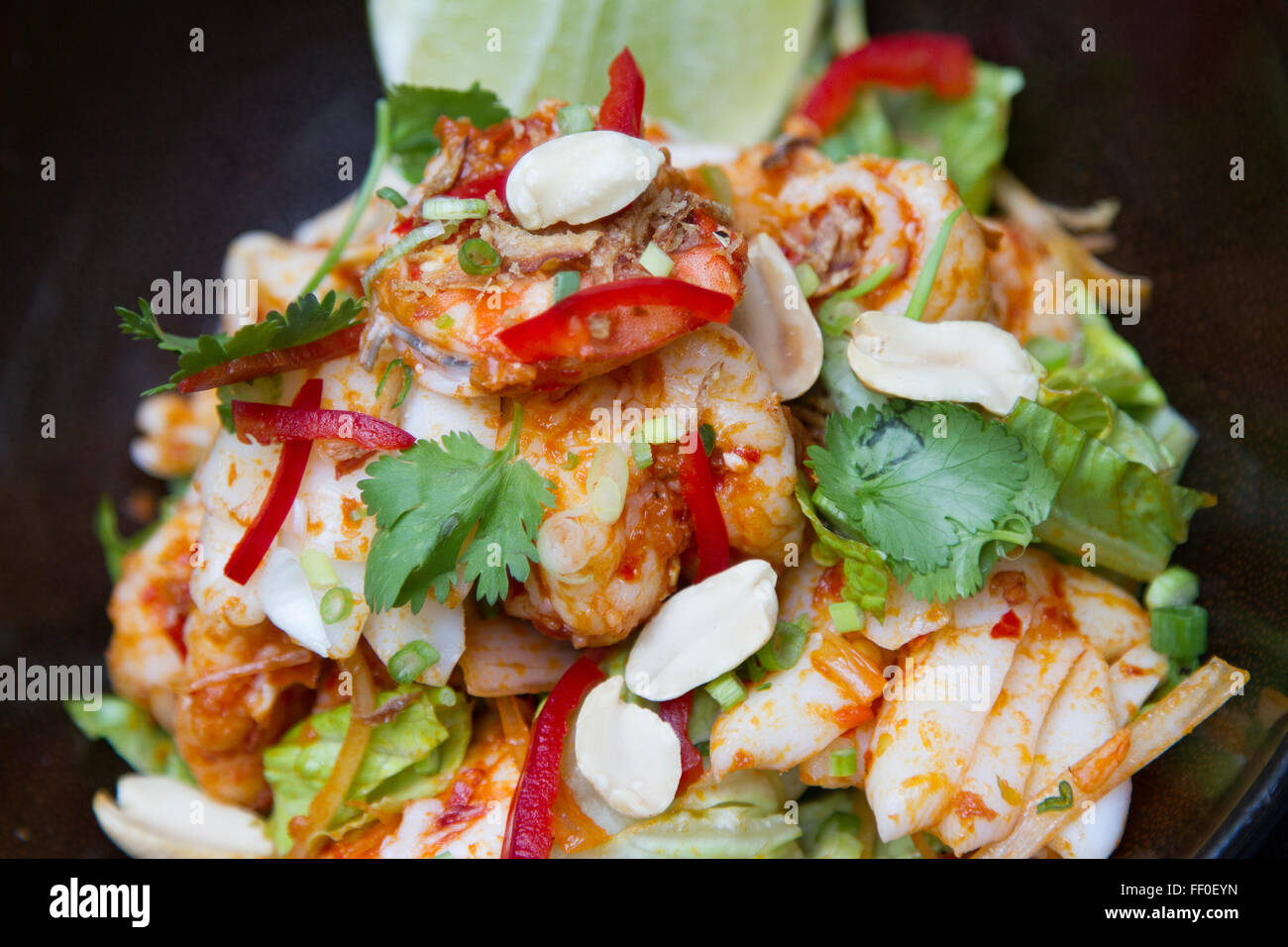 Spicy shrimps salad with coriander leaves Stock Photo
