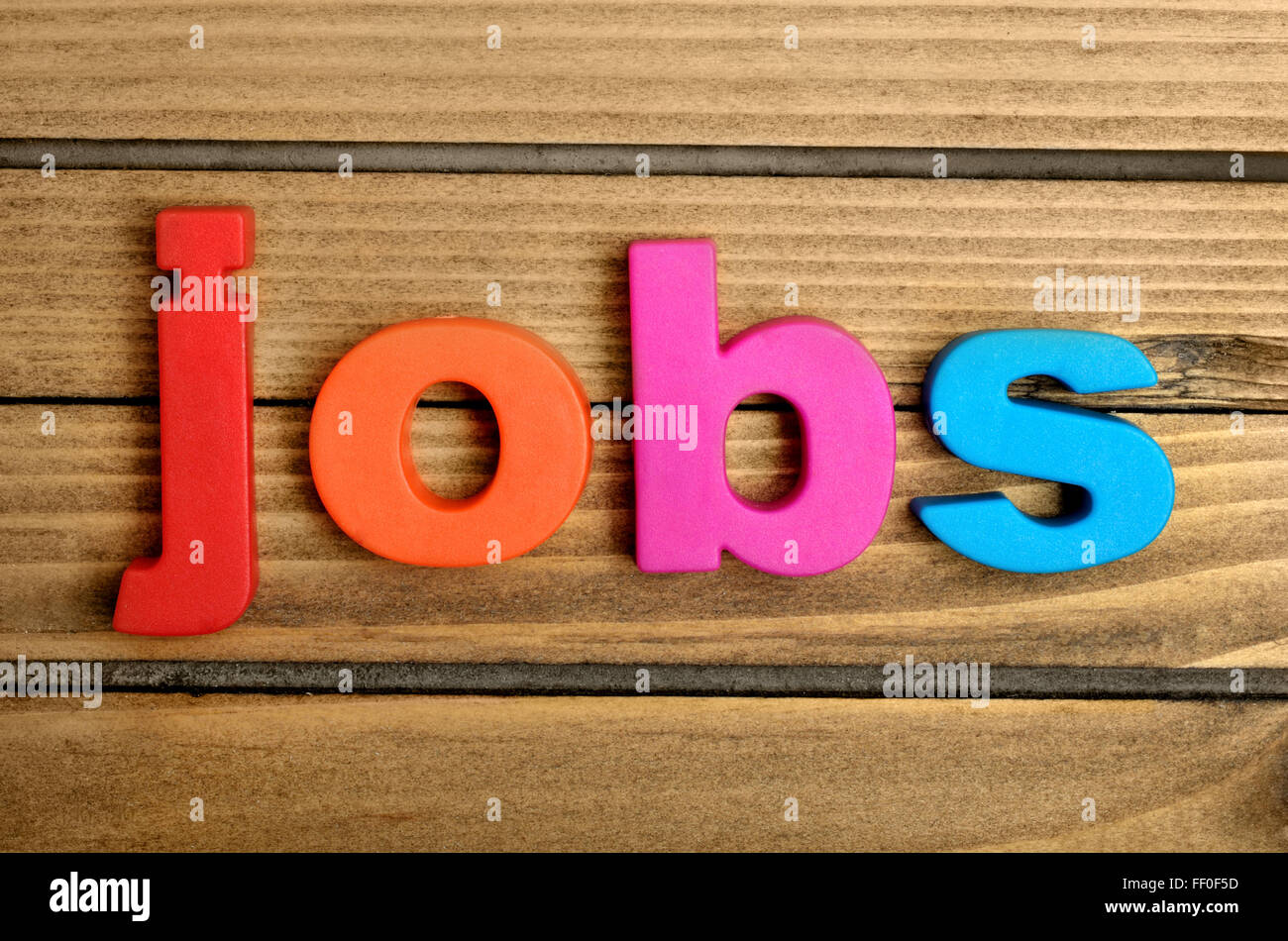 Colorful Jobs word on wooden table Stock Photo