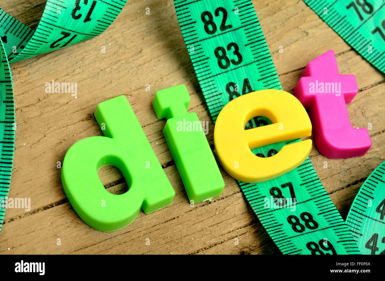 Colorful Diet word with centimeter on wooden table Stock Photo