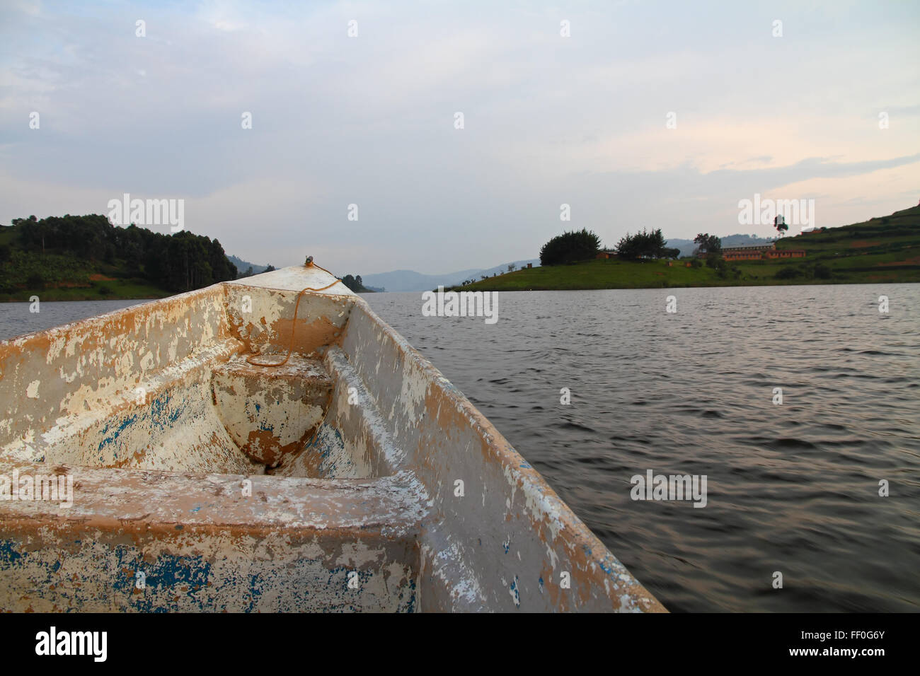 The front of a old boat launch on Lake Bunyoni, Uganda, surrounded by the homes of the community Stock Photo