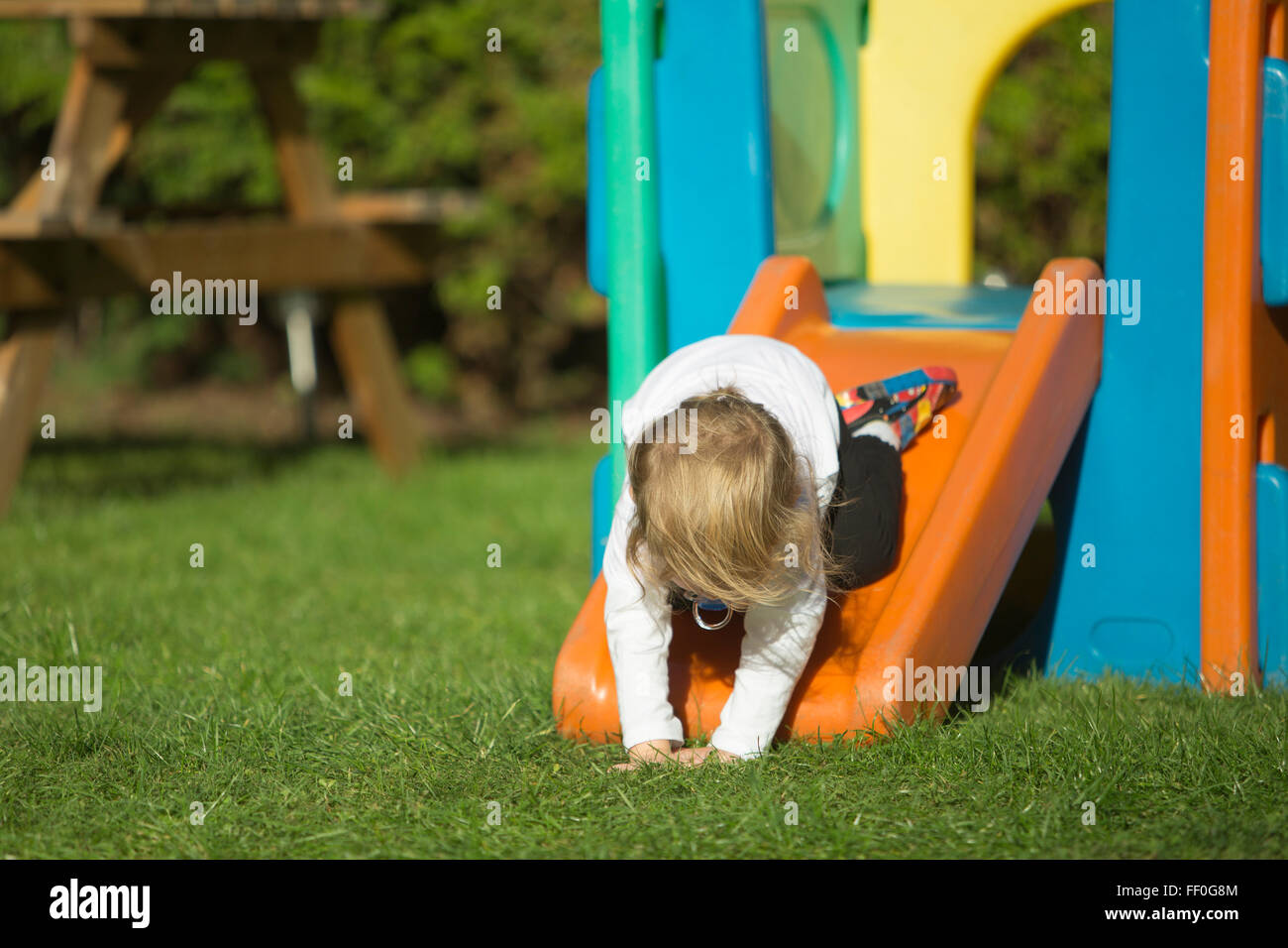 child falling off slide Stock Photo Alamy