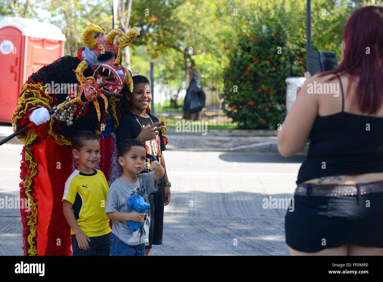 Traditional VEJIGANTE posing with kids during carnival in Ponce, Puerto Rico. US Territory. February 2016 Stock Photo