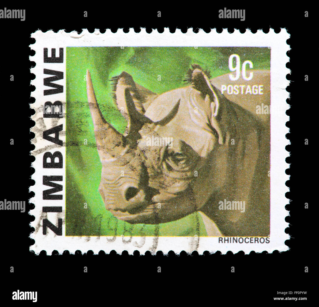 Postage stamp from Zimbabwe depicting a rhinoceros Stock Photo Alamy