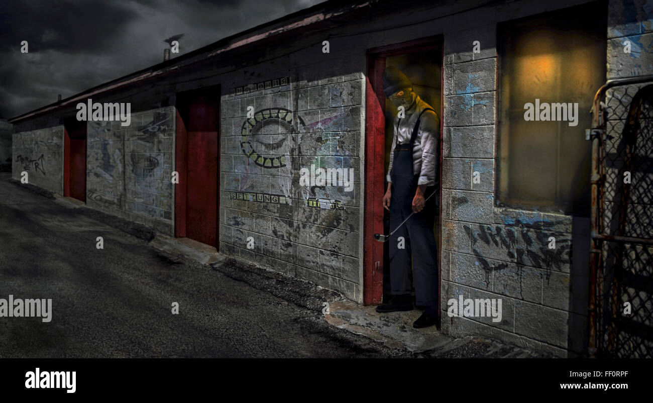 Man standing in dilapidated building doorway Stock Photo