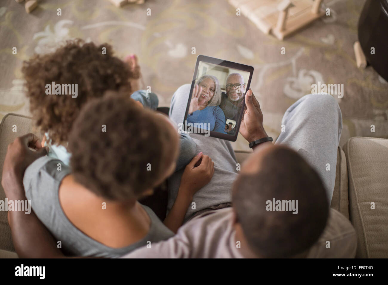 Family video chatting with digital tablet Stock Photo