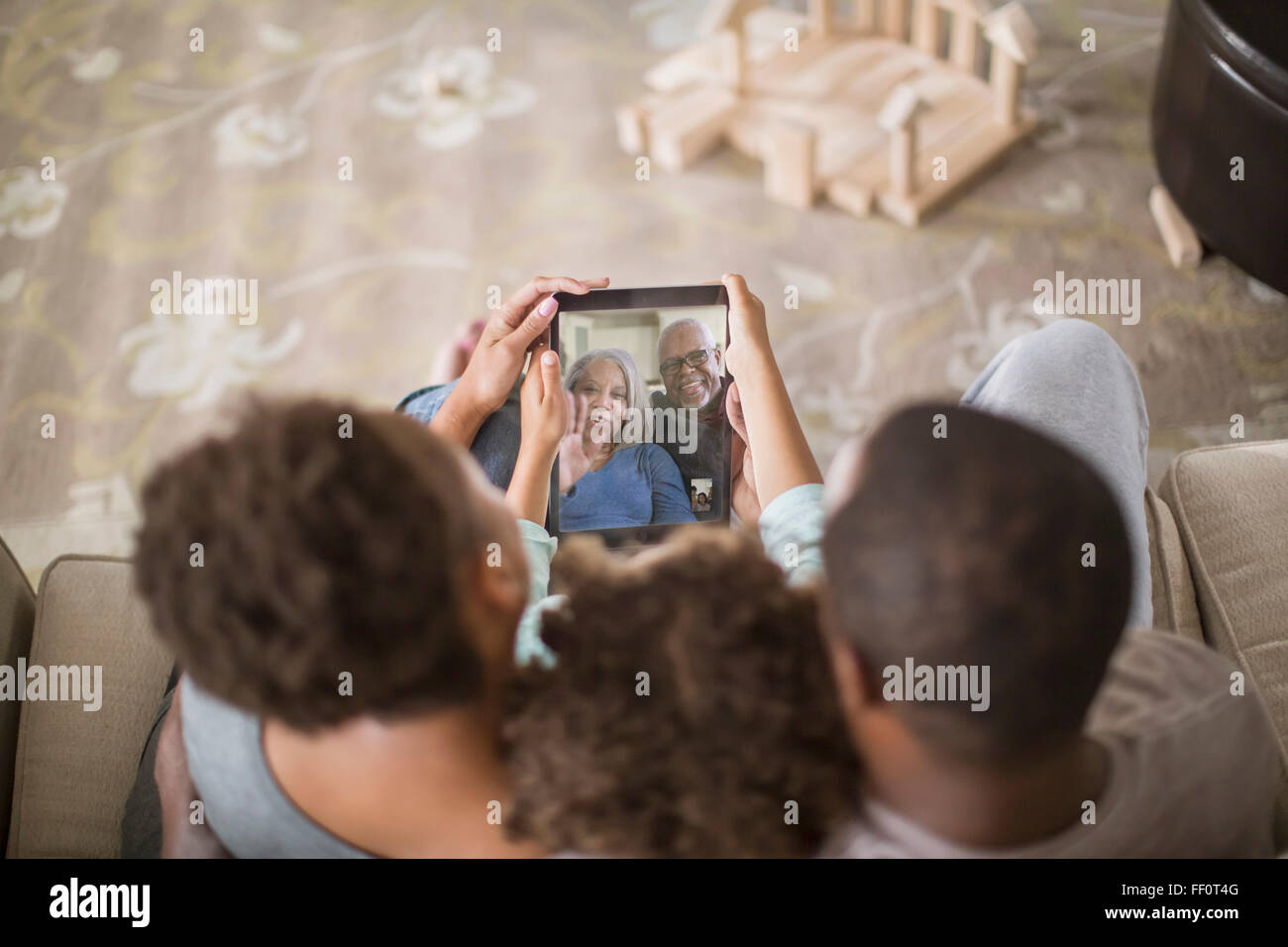 Family video chatting with digital tablet Stock Photo