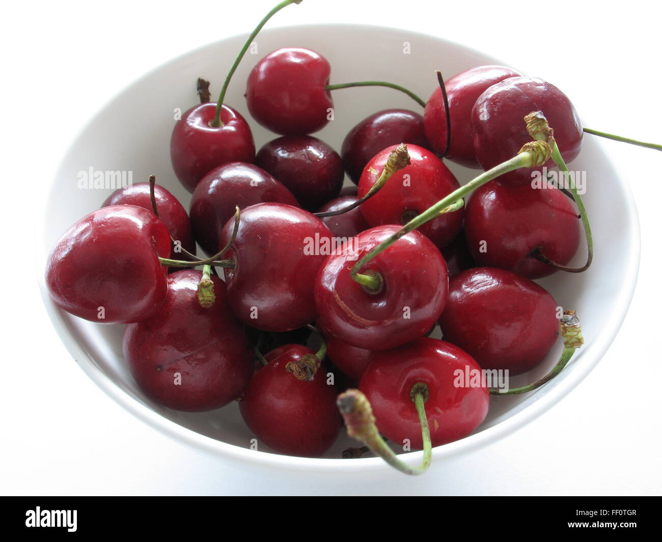 a lot of cherries in a dish Stock Photo