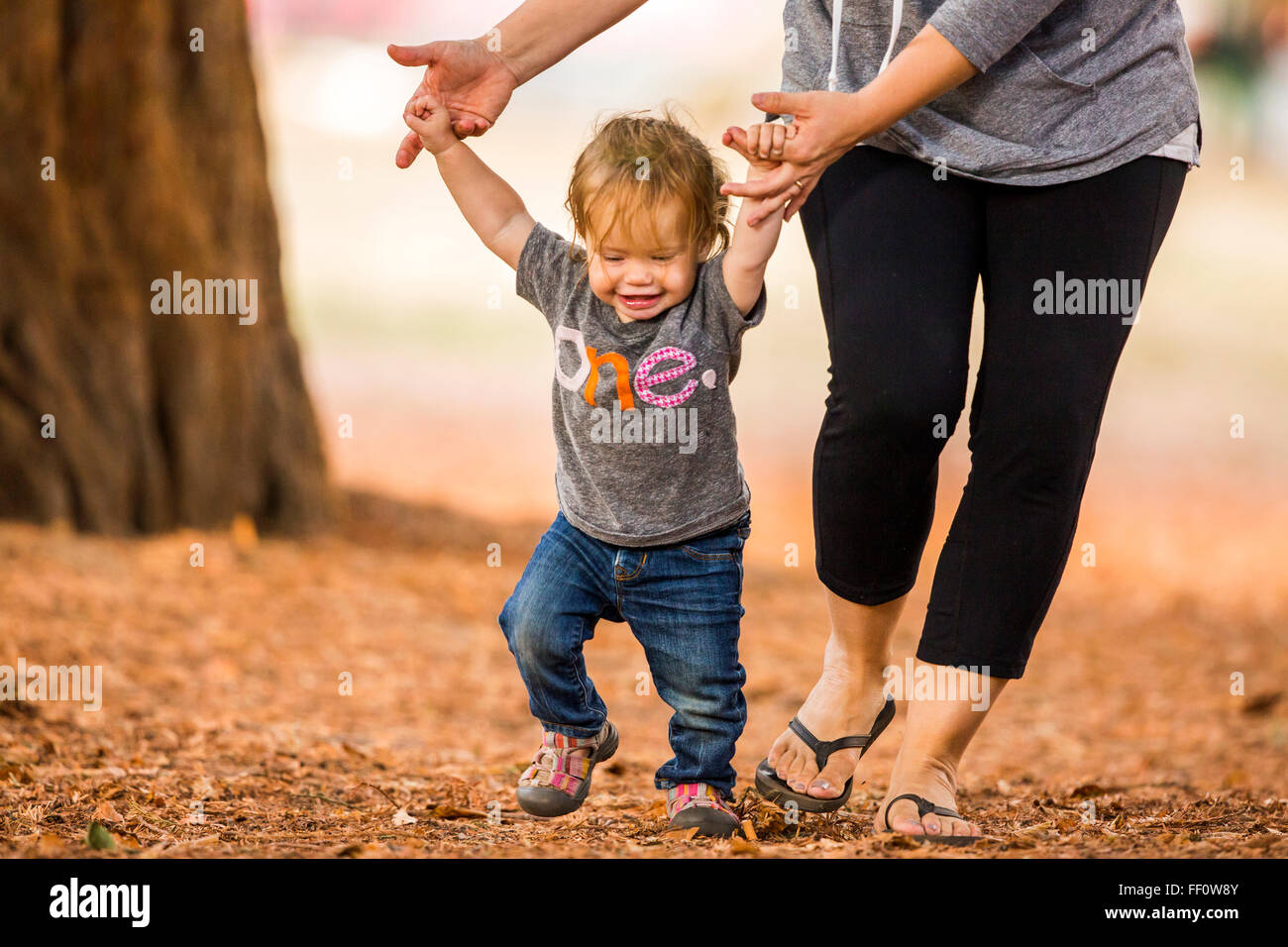 Caucasian mother and daughter walking outdoors Stock Photo