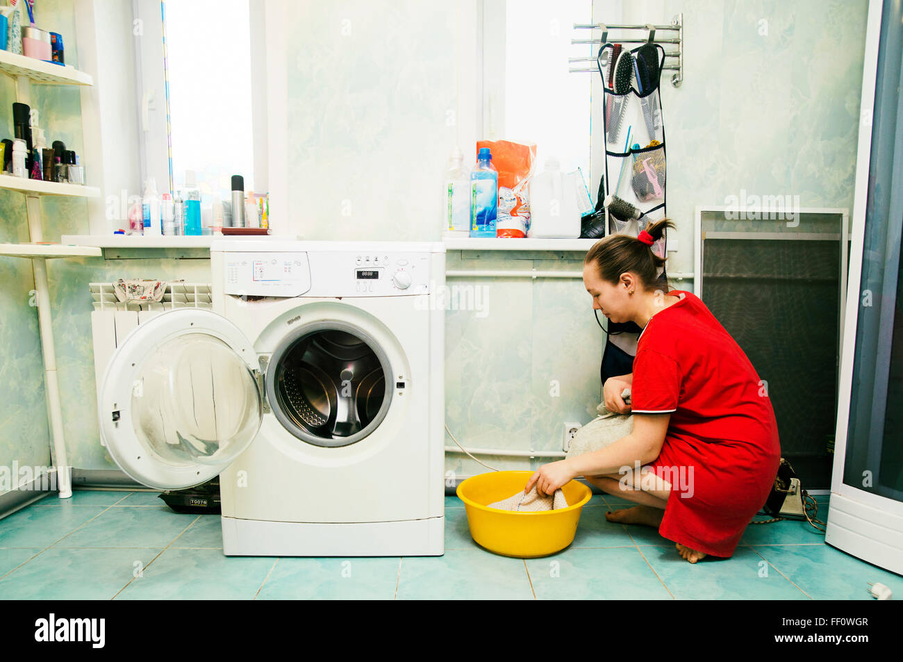 Caucasian woman hand-washing laundry Stock Photo