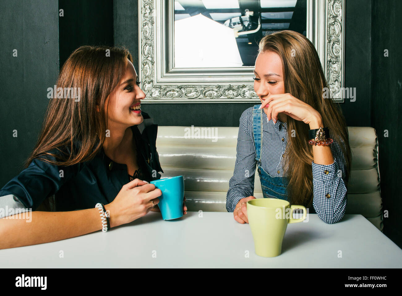 Women talking in coffee shop Stock Photo