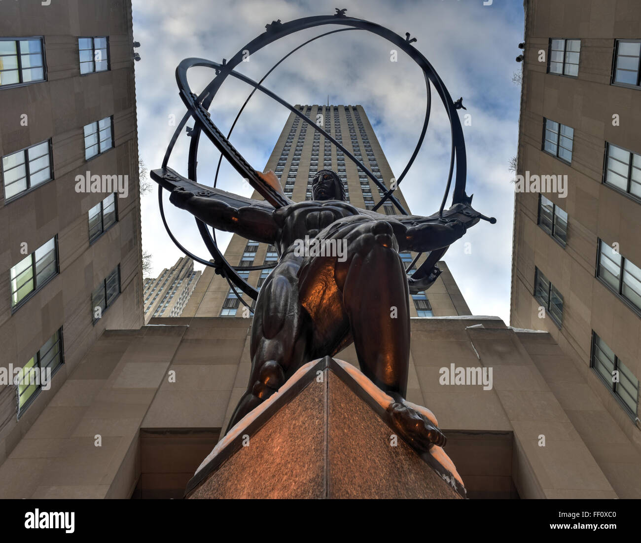 New York - January 24, 2016: Snow covered Atlas Statue at Rockefeller Center in New York. The Atlas Statue is a bronze statue in Stock Photo