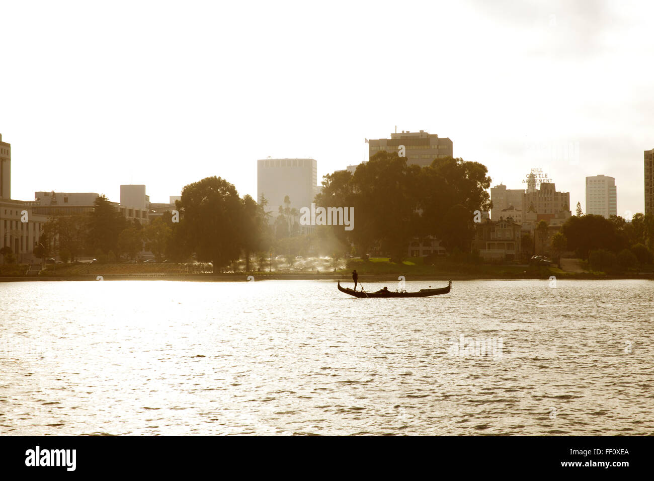 Silhouette of a gondola on Lake Merritt in the afternoon sunlight. Stock Photo