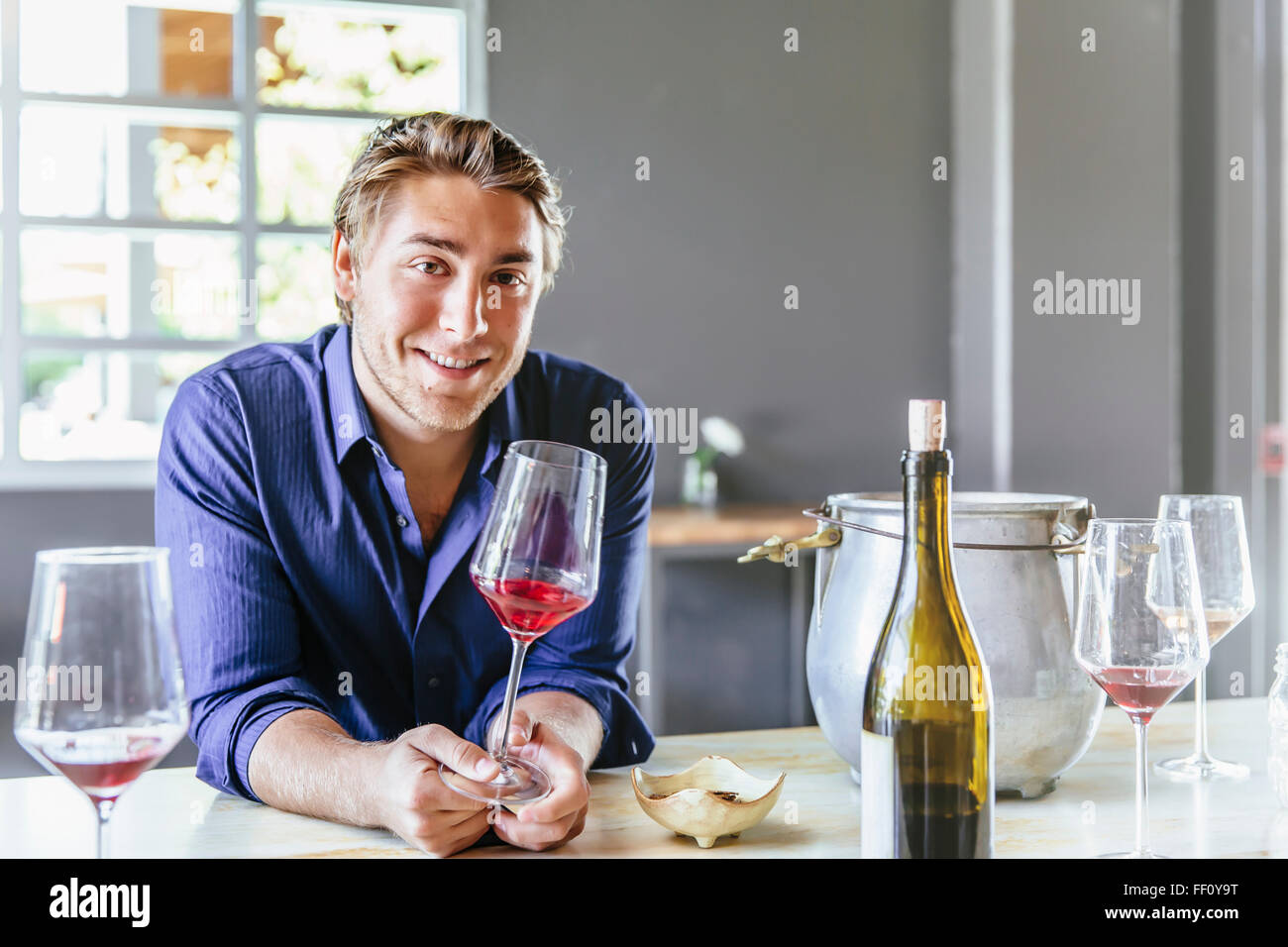 Caucasian man drinking wine in restaurant Stock Photo - Alamy