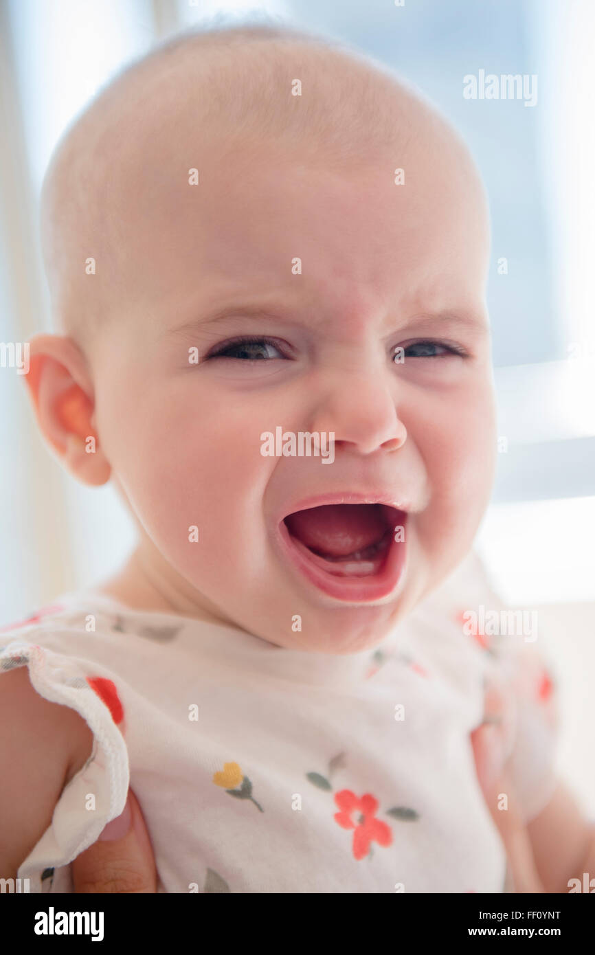 Caucasian baby girl crying Stock Photo