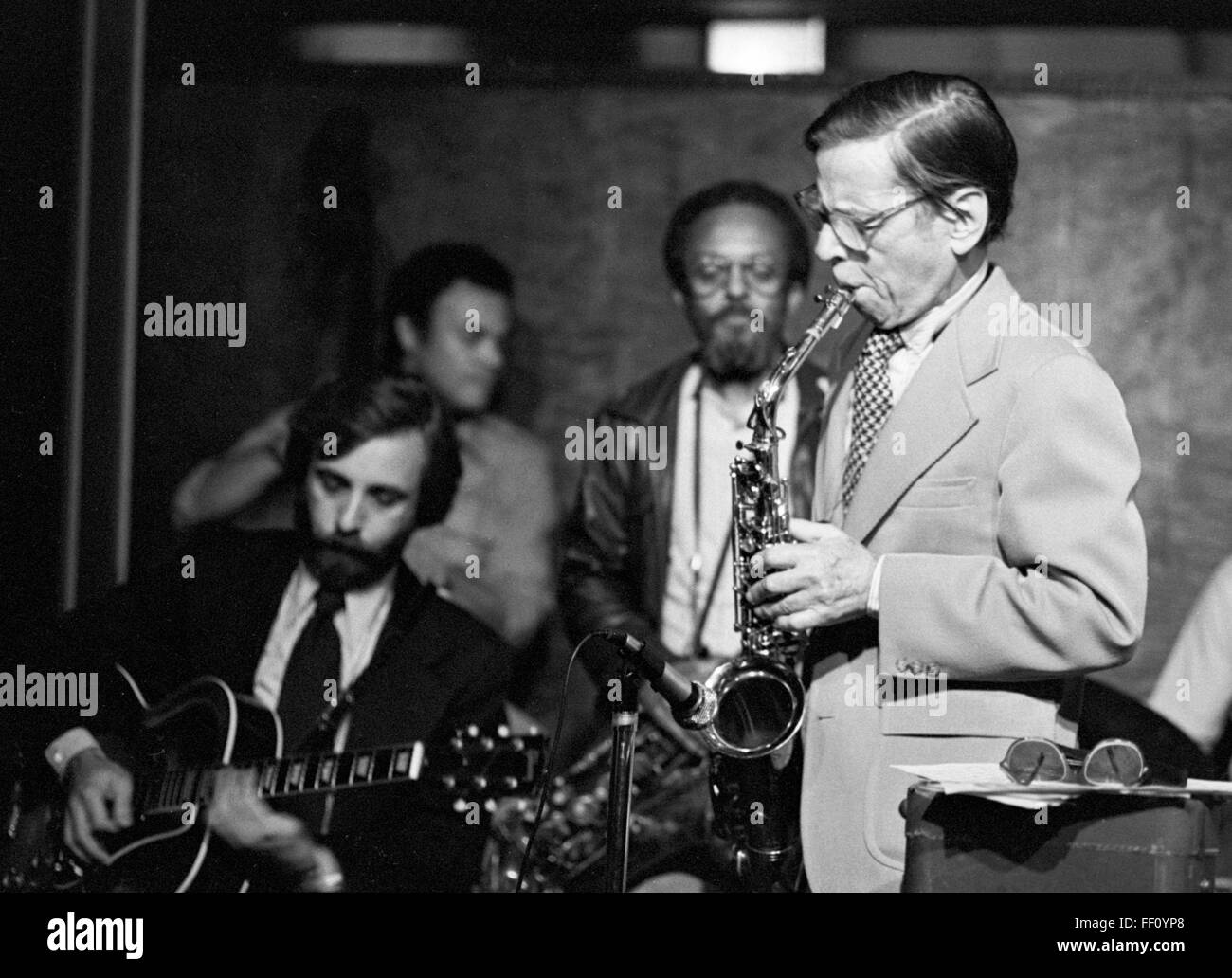 Les Lieber on sax, Bill Wurtzel guitar, Earl May bass, and Jimmy Heath, at Les Lieber’s “Jazz at Noon” on 58th Street in Manhattan. The date is most likely January 11, 1980, at a jam session featuring Doc Cheatham (not pictured here). Stock Photo