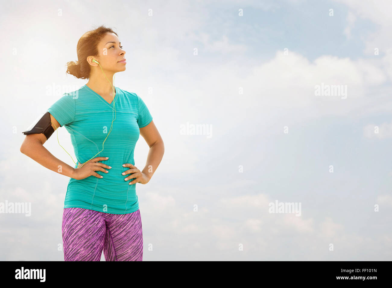 Mixed race runner standing outdoors Stock Photo - Alamy
