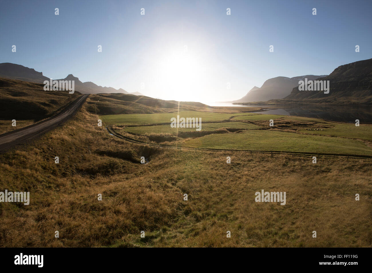 Sunrise over remote fields Stock Photo