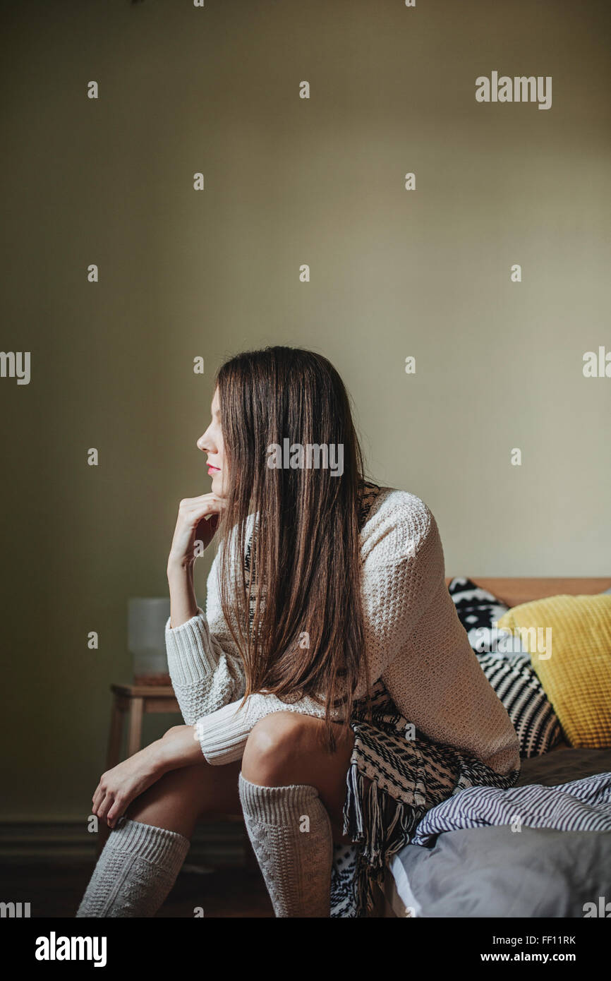 Woman sitting back view knee hi-res stock photography and images - Alamy