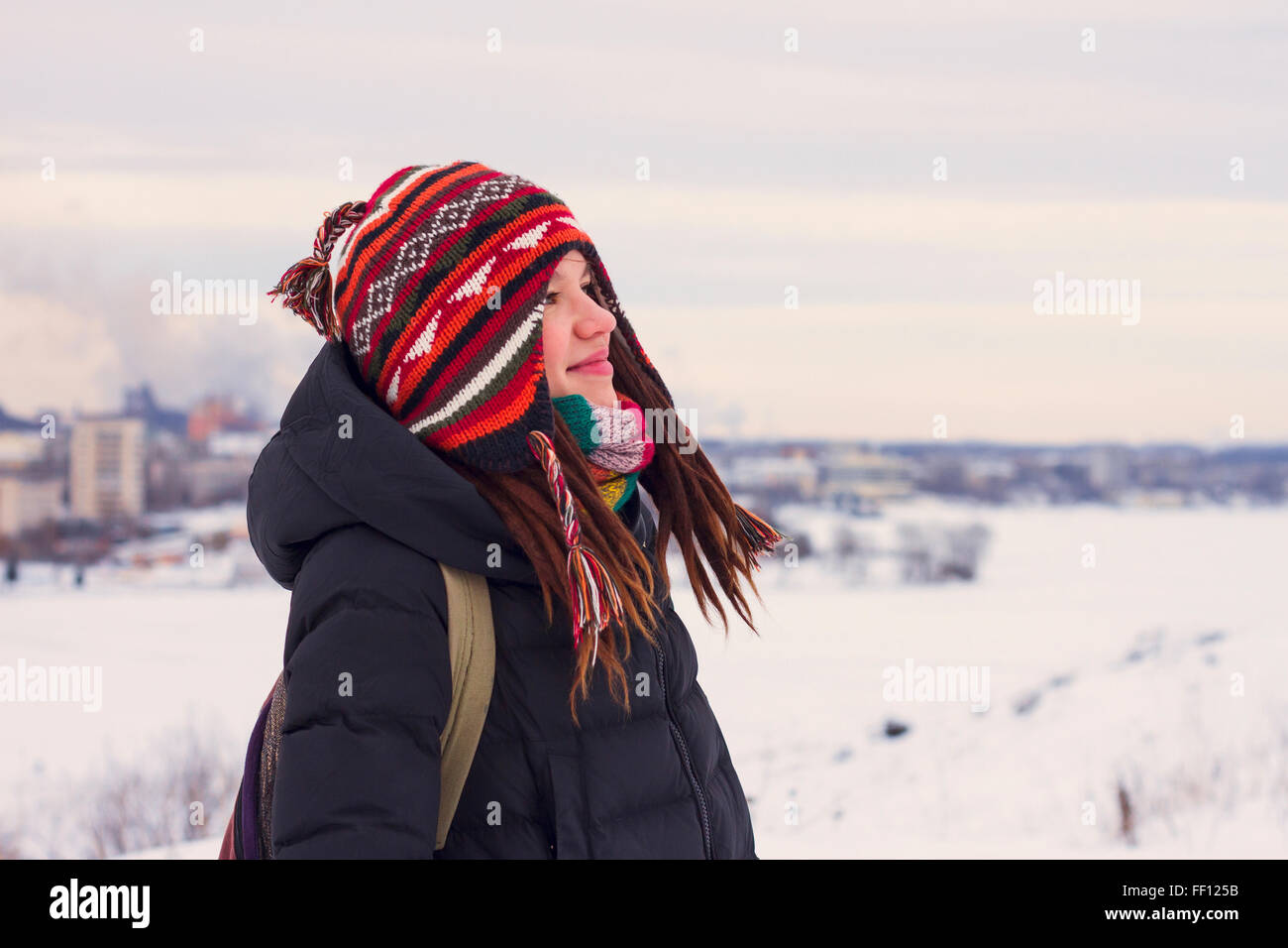 Caucasian woman admiring snowy landscape Stock Photo