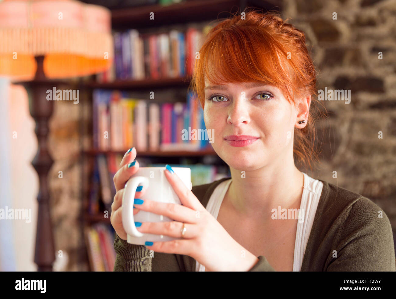 Caucasian woman drinking coffee Stock Photo
