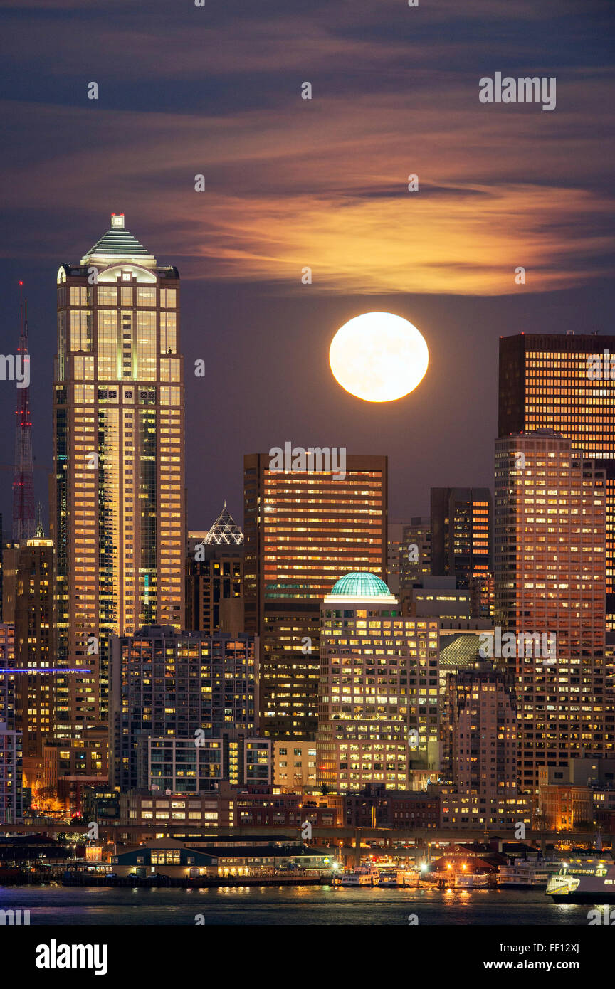 Moon and high rise buildings over Seattle waterfront, Washington, United States Stock Photo