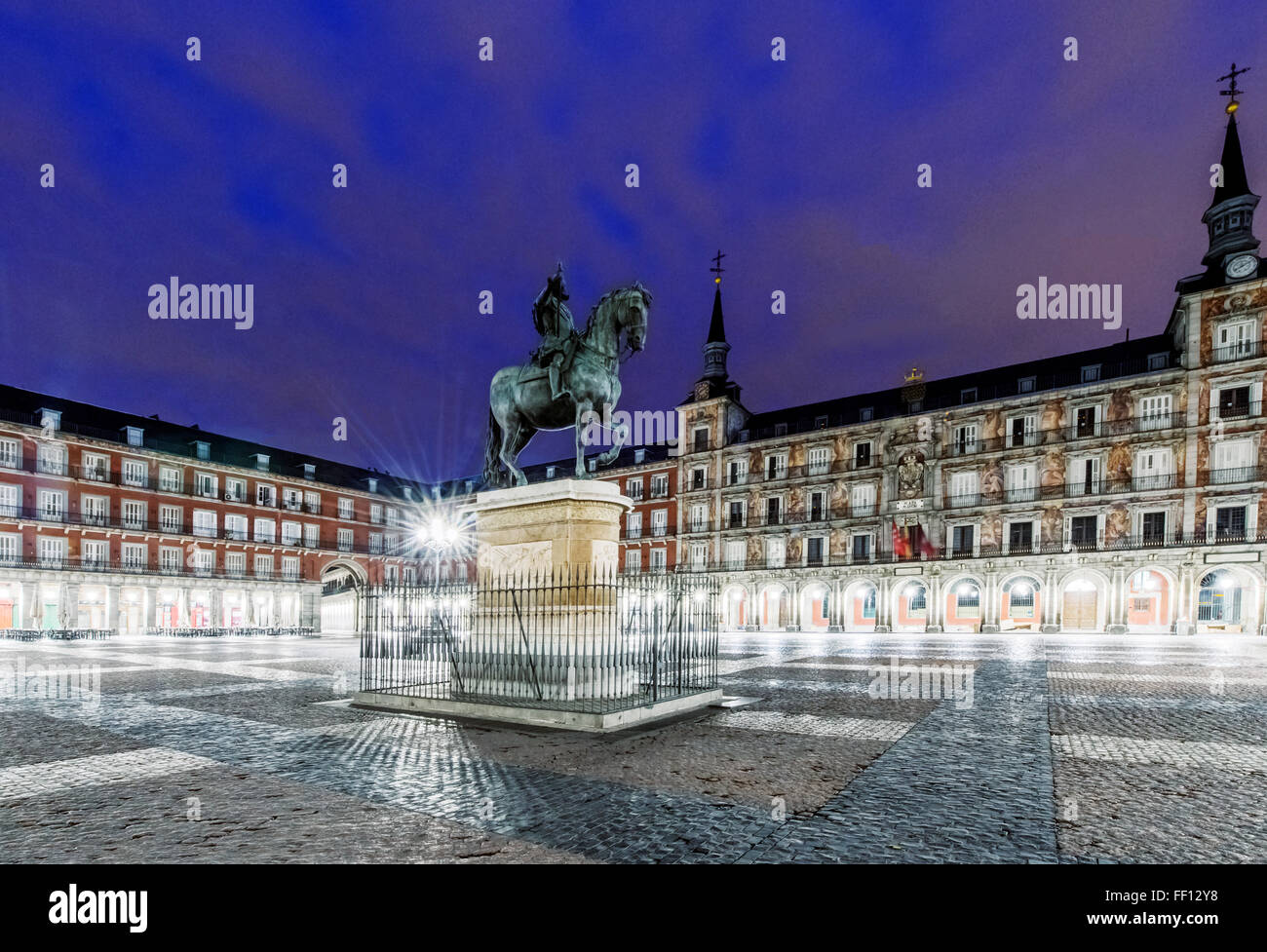 Ornate building and statue illuminated at night, Madrid, Madrid, Spain Stock Photo