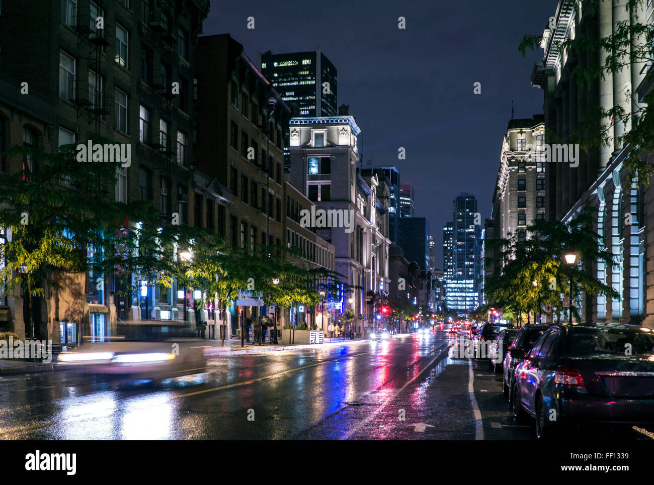 Traffic in wet cityscape at night Stock Photo