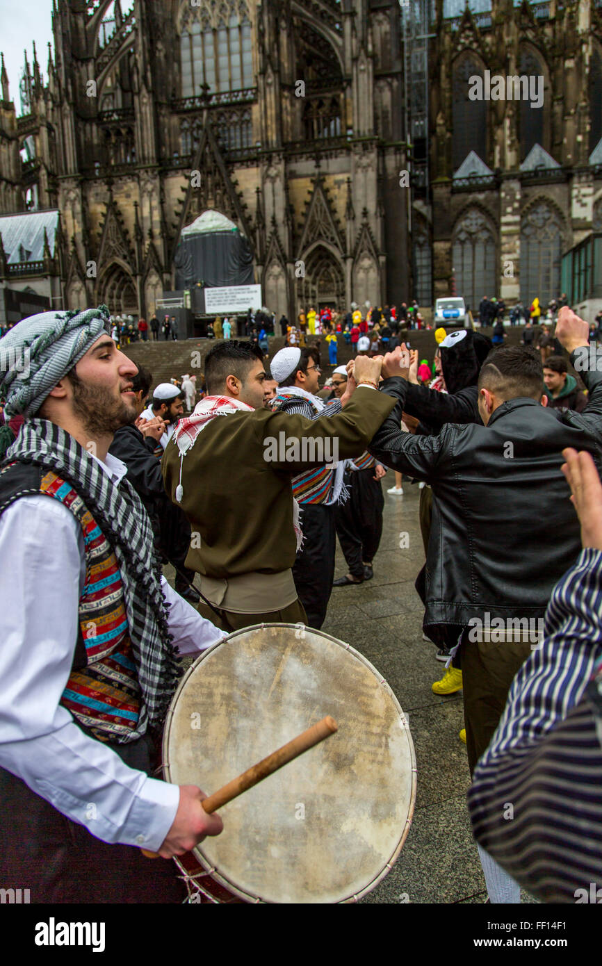 Street carnival in Cologne, Germany, Syrian folk group take part in the street carnival party, refugees group, Stock Photo