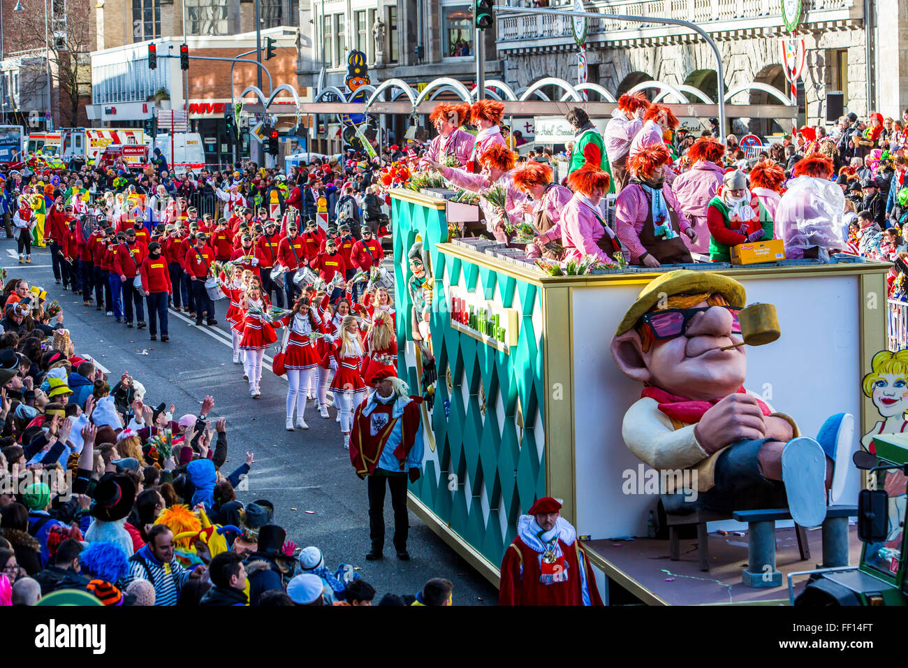 Street carnival parade and party in Cologne, Germany, at Carnival Monday, Shrove Monday, Rose Monday, people in costumes, Stock Photo