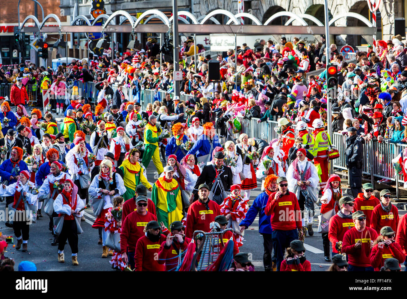 Street carnival parade and party in Cologne, Germany, at Carnival Monday, Shrove Monday, Rose Monday, people in costumes, Stock Photo