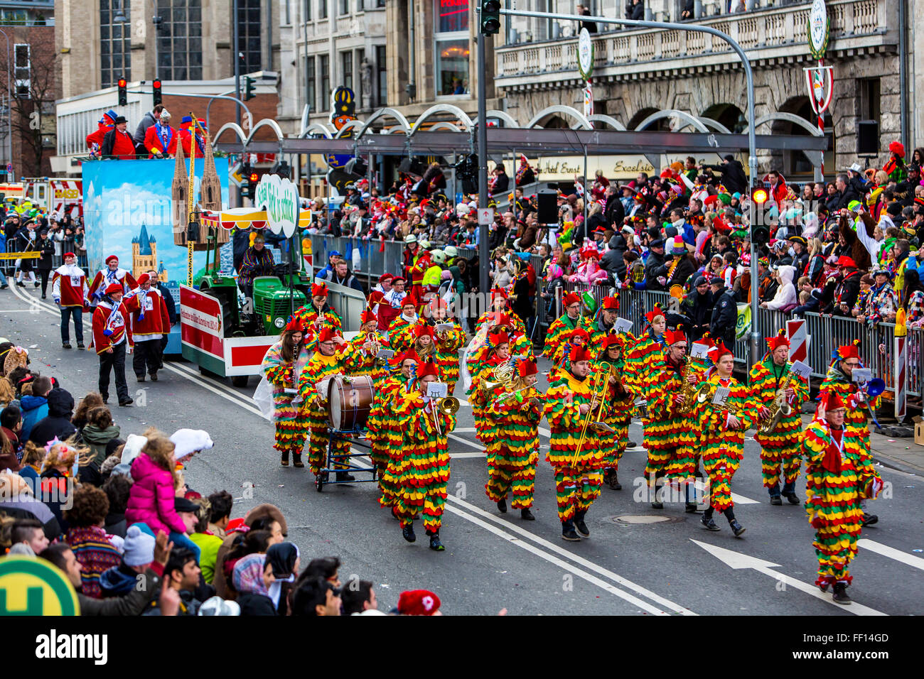 Street carnival parade and party in Cologne, Germany, at Carnival Monday, Shrove Monday, Rose Monday, people in costumes, Stock Photo